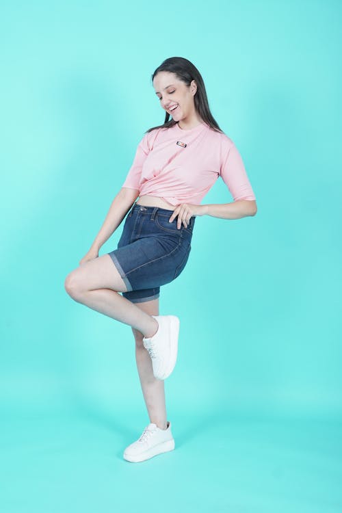 Model Posing in Denim Shorts