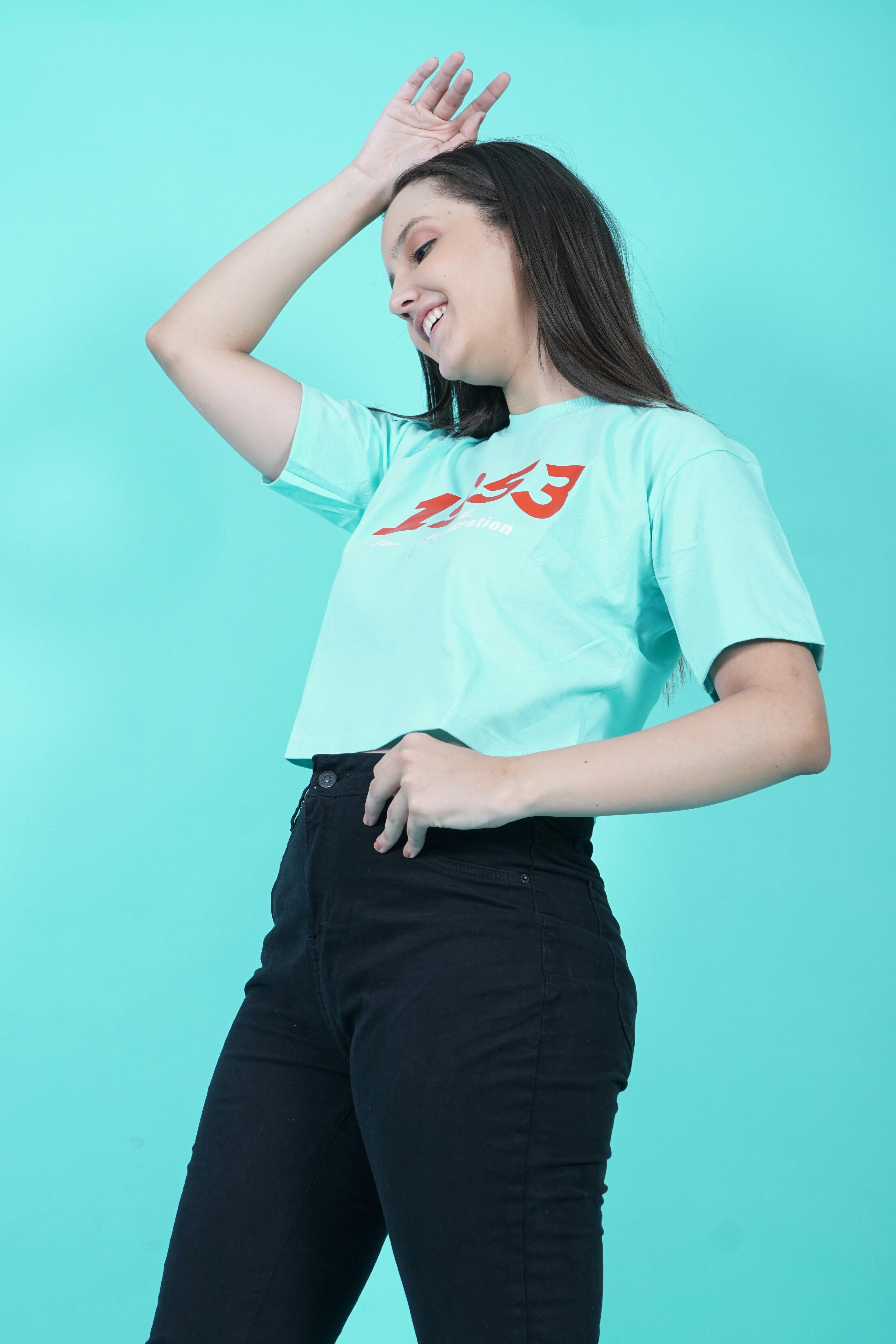 Portrait Of A Beautiful Stylish Young Brunette In Crop Top And Jeans. Stock  Photo, Picture and Royalty Free Image. Image 46512737.