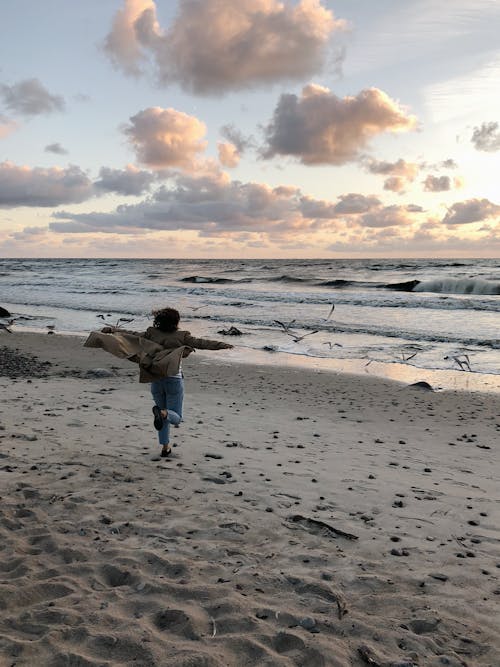 Person Running On Shore 