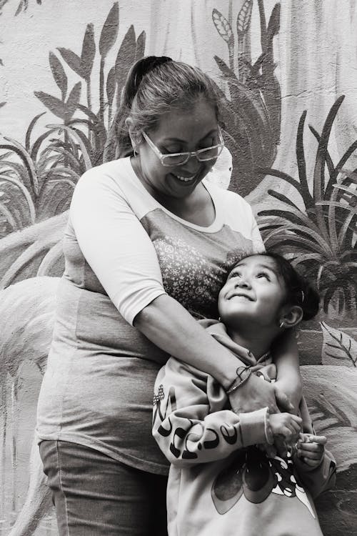 Mother Hugging Daughter in Black and White