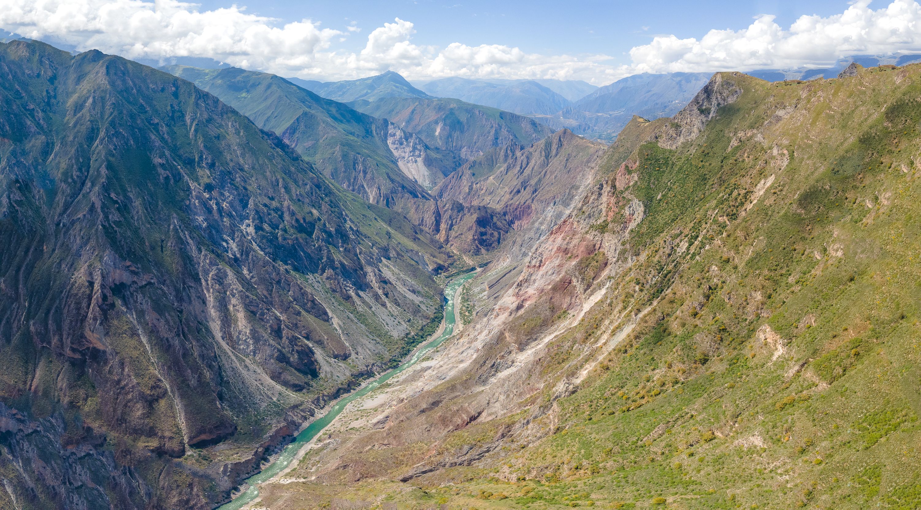 Aerial view of a lush green valley and river in Peru (Curahuasi, Apurímac — region-wide image, not Oxapampa)