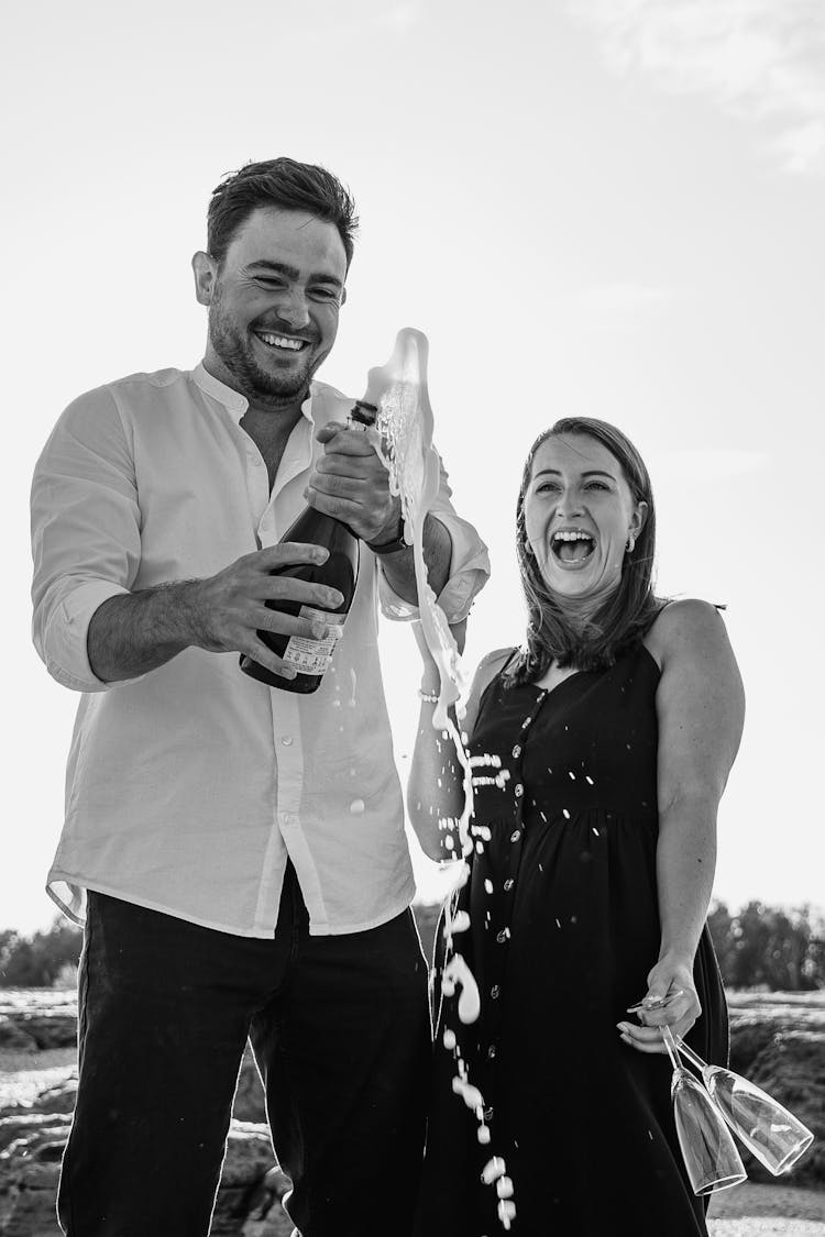 Smiling Man And Woman With Champagne