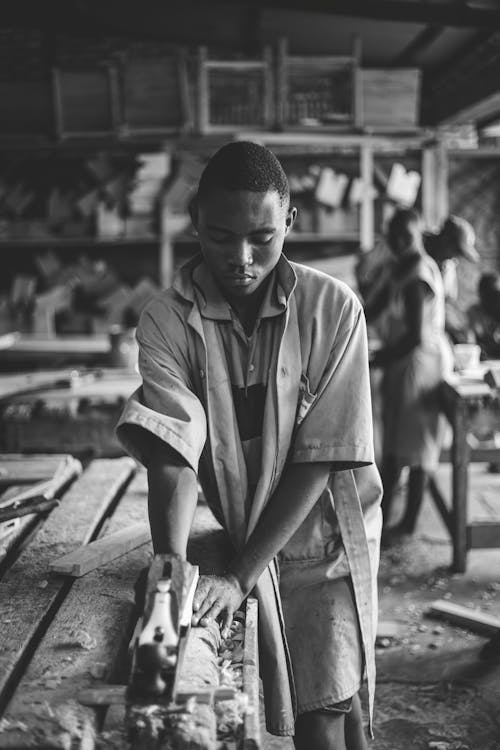 Young Carpenter Working in a Workshop