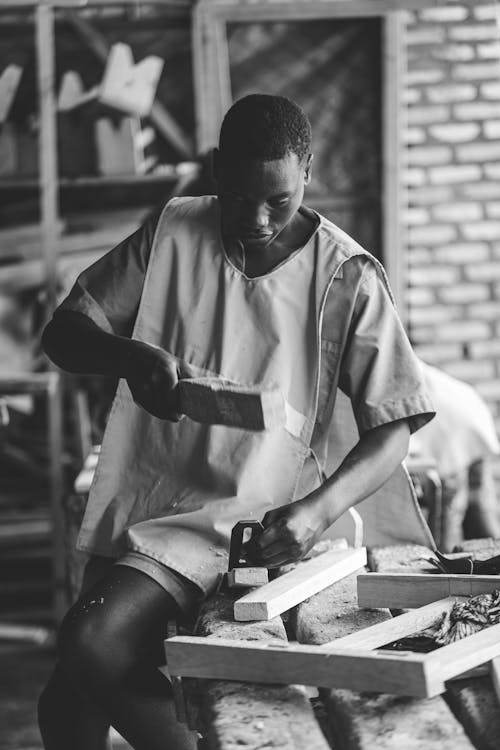 Trainee Working with Wood in a Workshop