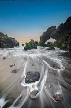 Stunning view of ocean rock formations at sunrise in Jawa Barat, Indonesia.