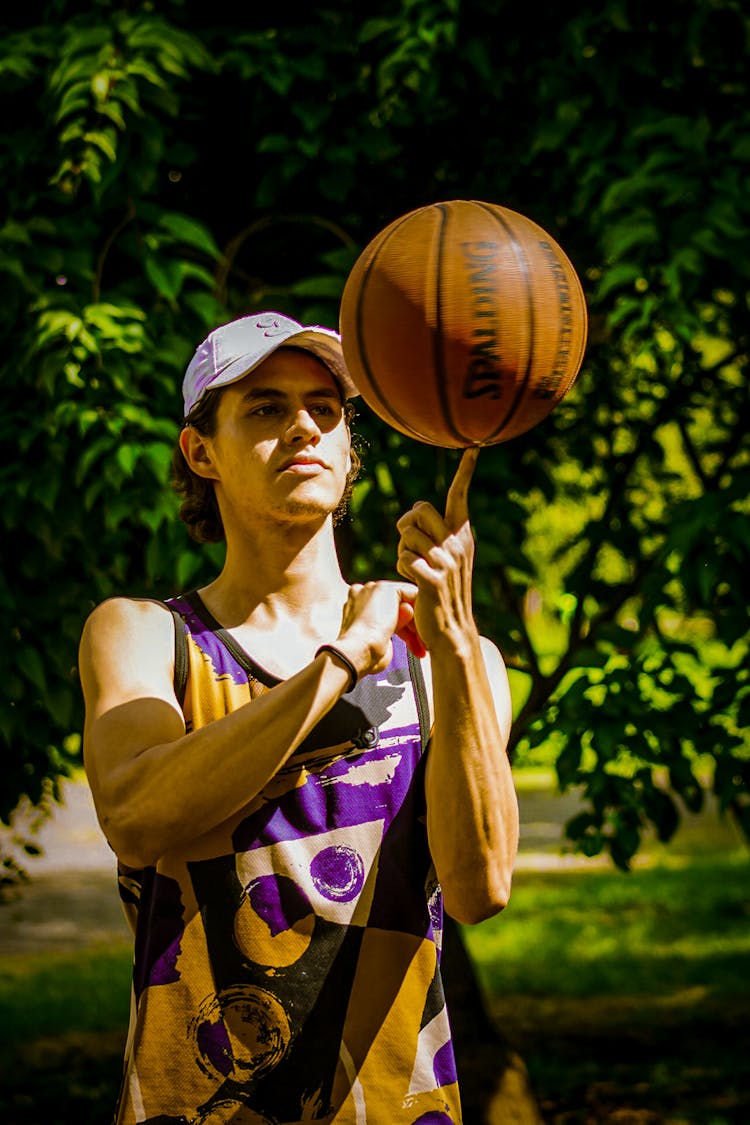 Athlete Spinning Basketball On Finger