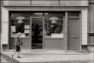 Timeless street scene featuring a classic butcher shop facade in black and white.