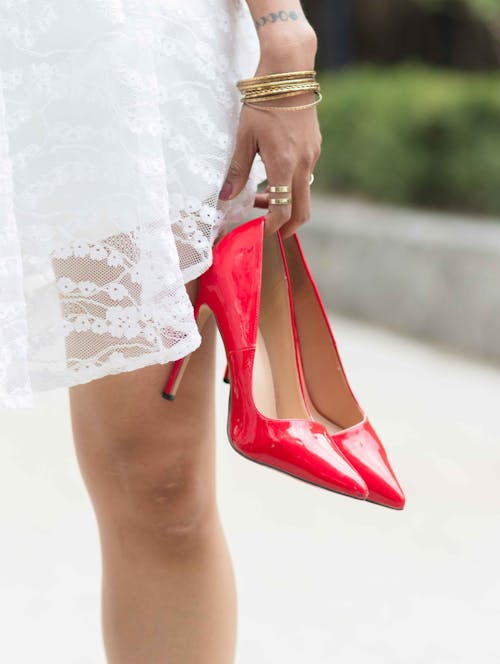 Bride Holding Red Pumps