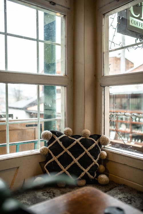Pillow in Corner Between Windows