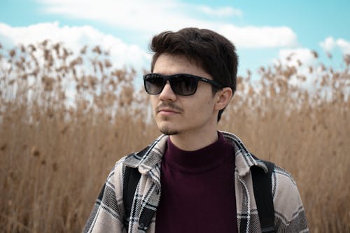 Young Man in Jacket and Sunglasses