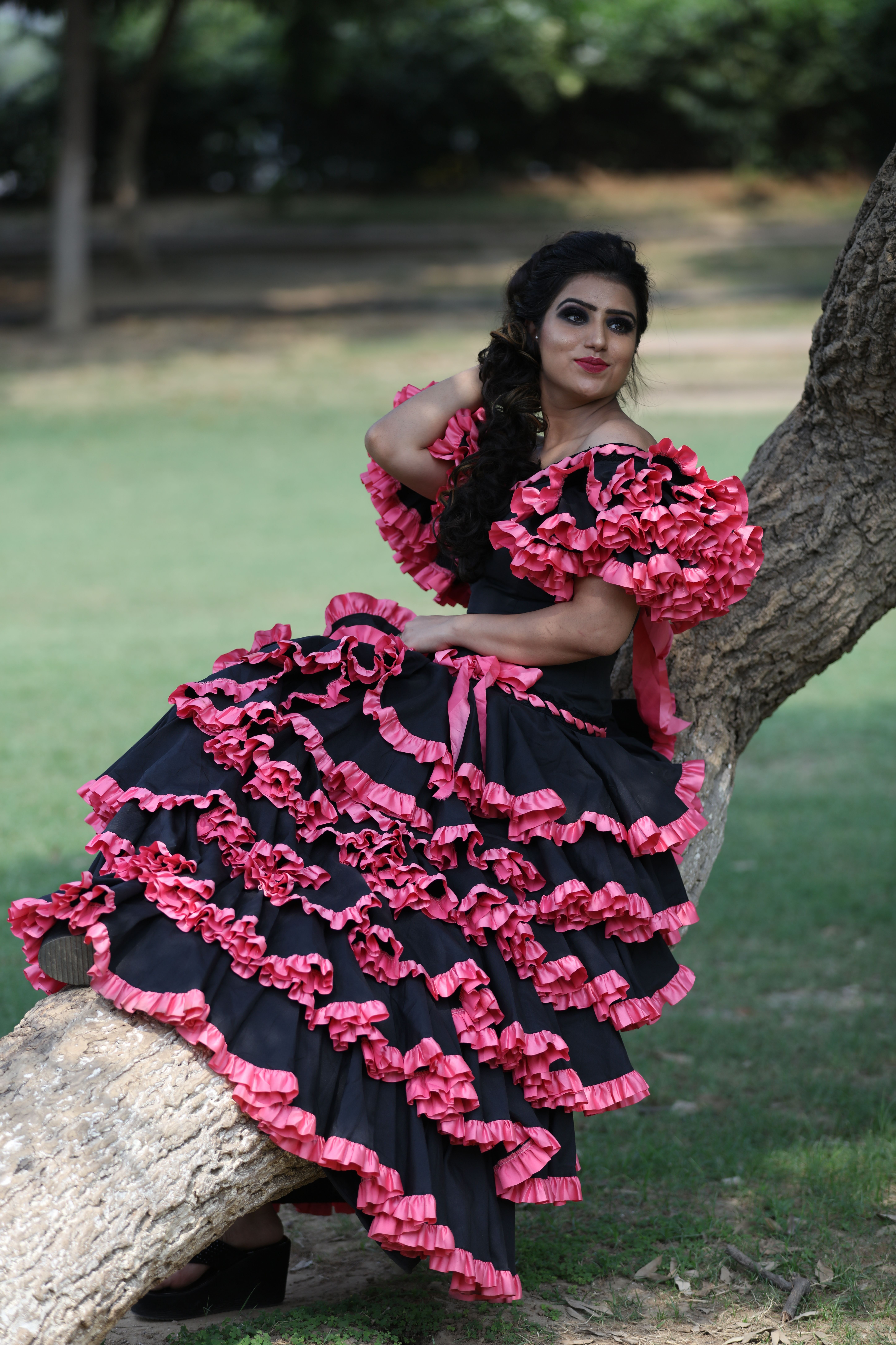 Woman in a Traditional Dress Sitting on a Tree Trunk in a Park · Free ...