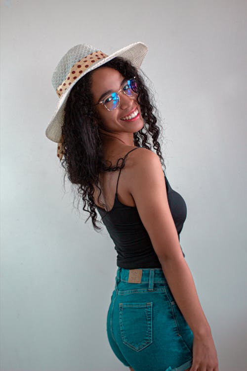 Young Woman in a Casual Summer Outfit Posing and Smiling 