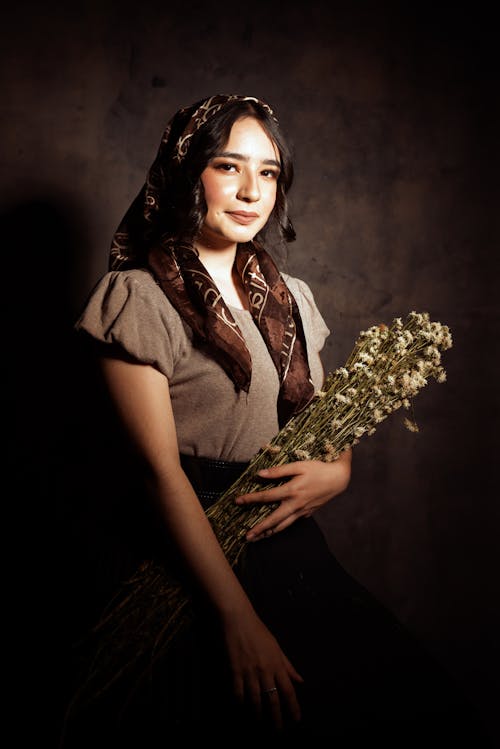 Portrait of Woman in Shawl and with Flowers