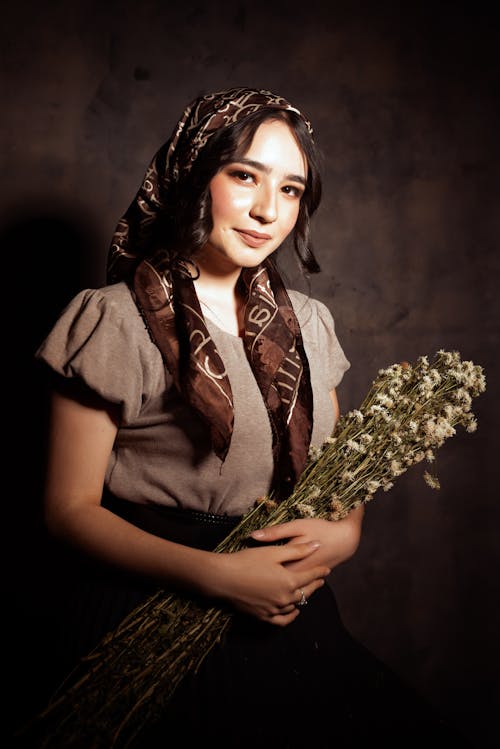 Woman in Shawl Posing with Flowers