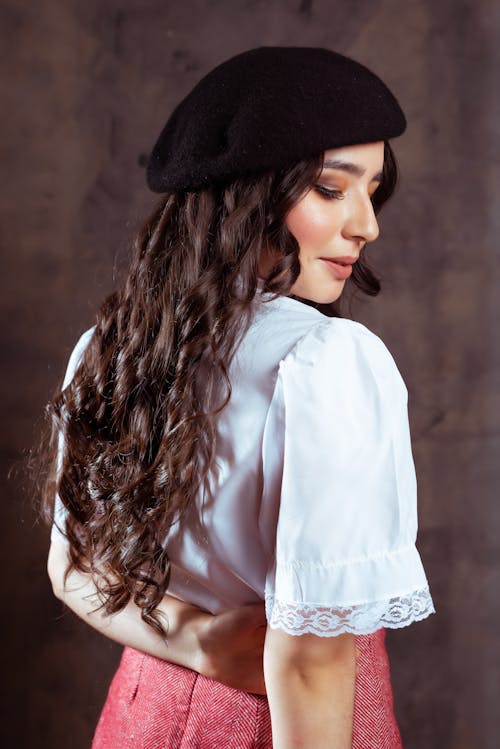 Woman with Long Hair Posing in Hat