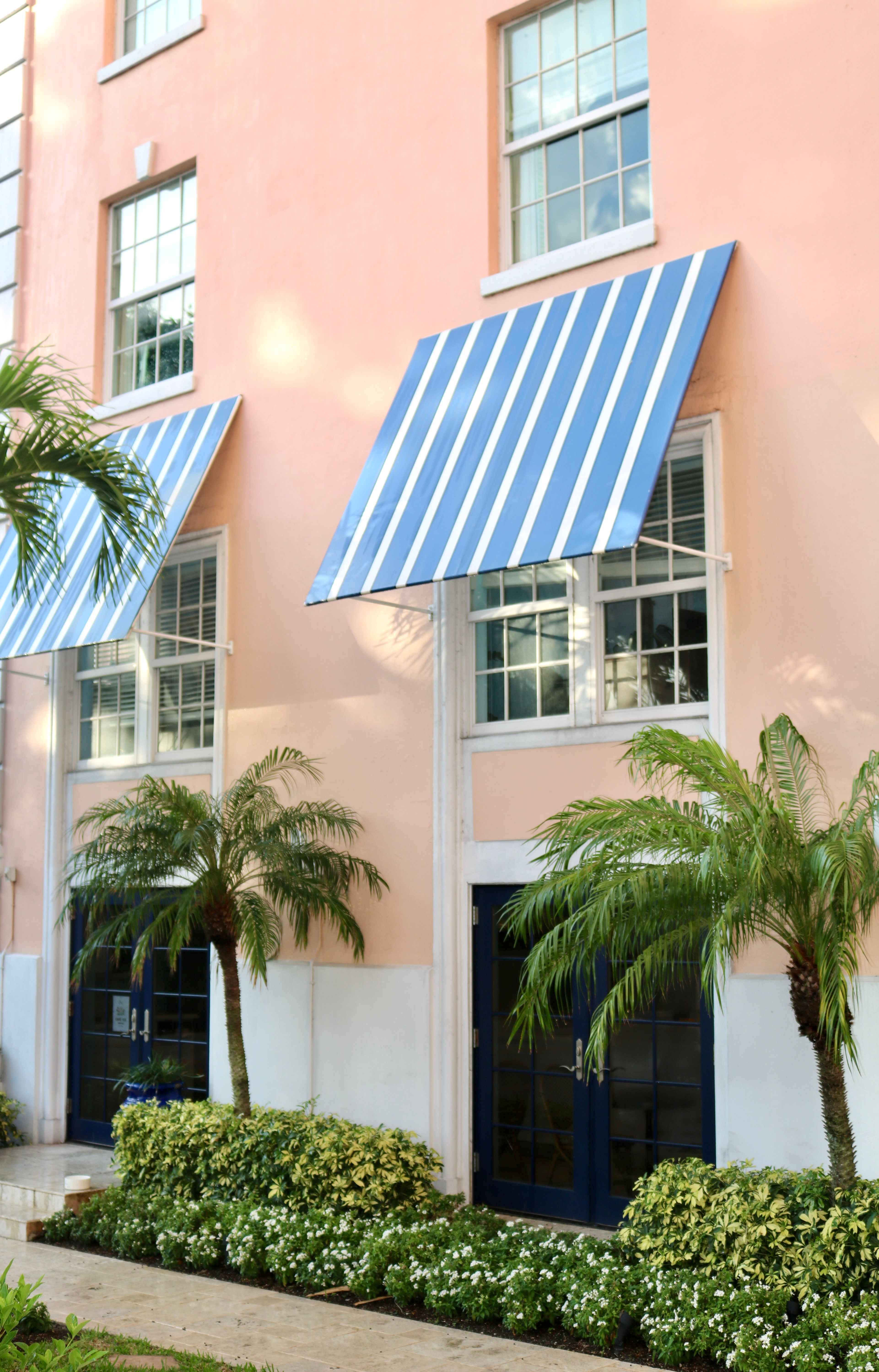 Solar Panels above Building Entrance Covering Windows · Free Stock Photo