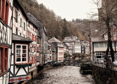Free Picturesque half-timbered houses along the Rur River in Monschau, Germany, during fall. Stock Photo
