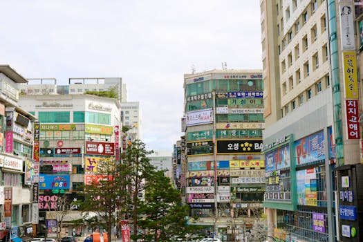 A colorful cityscape showcasing vibrant advertisements and urban architecture in Seoul, South Korea.