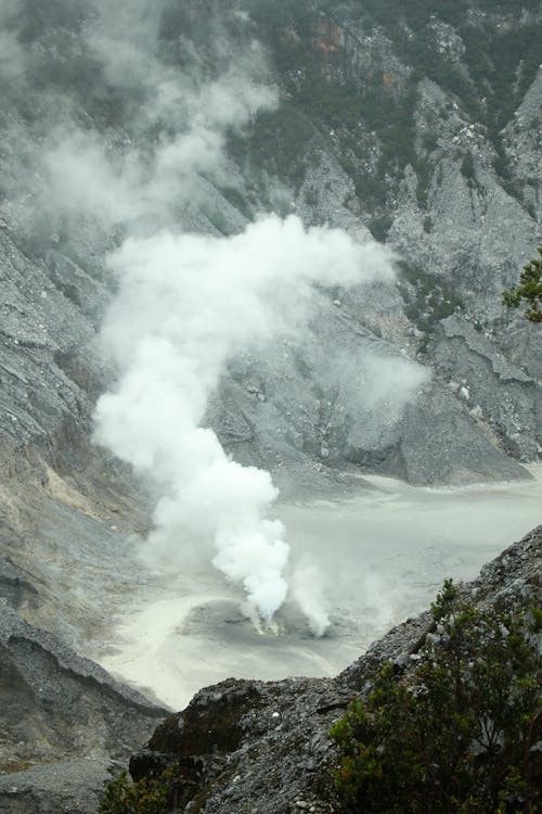 Steam from Geyser among Rocks
