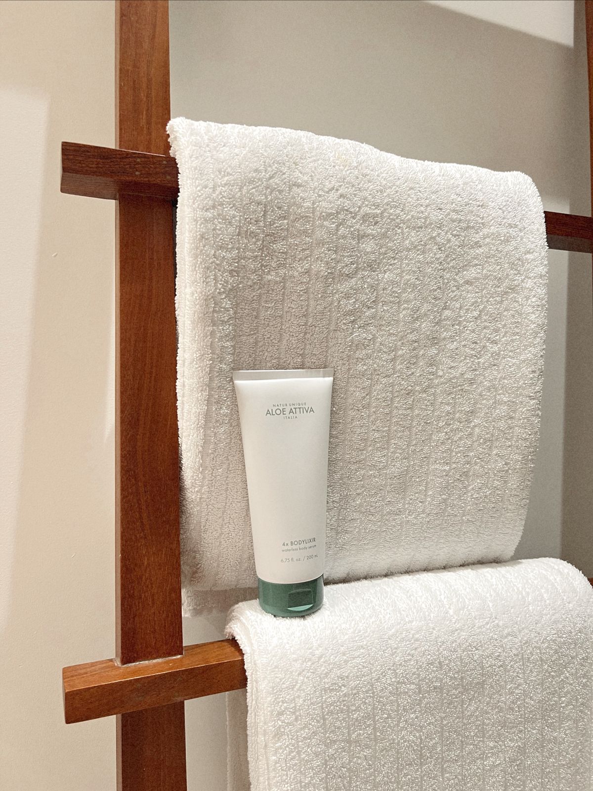 Moisturiser and towel for tanning aftercare