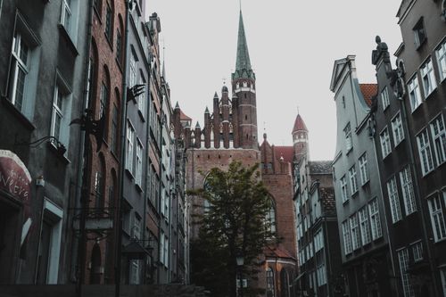 Free Charming view of historic architecture and a cathedral tower in Gdańsk, Poland. Stock Photo