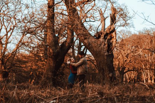 Romantic Boho Engagement Photoshoot of couple in the Woods