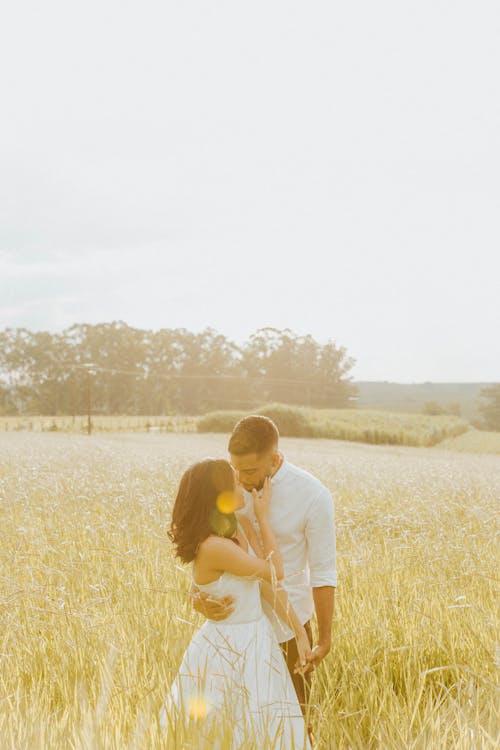 Couple Kissing on Rural Field