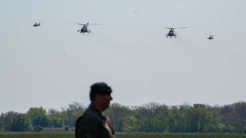 Free Four military helicopters pass by Stock Photo