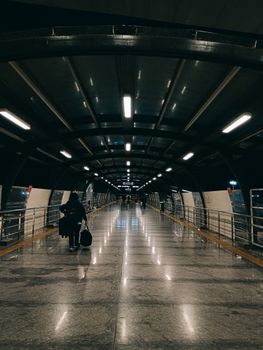 A sleek, urban corridor in Bengaluru Airport at night, showcasing a contemporary travel experience.