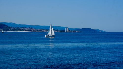 Free A tranquil scene of a sailboat gliding across the blue waters of Vigo Bay, Spain. Stock Photo