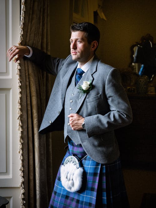 Man in Suit and Scottish Kilt