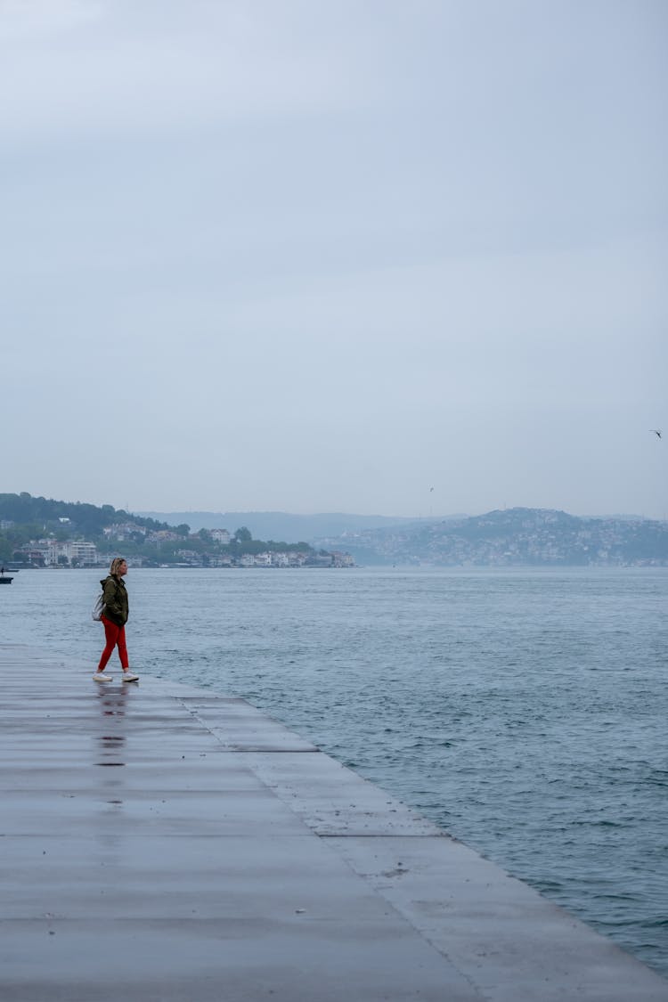 A Woman On The Beach In Distance 