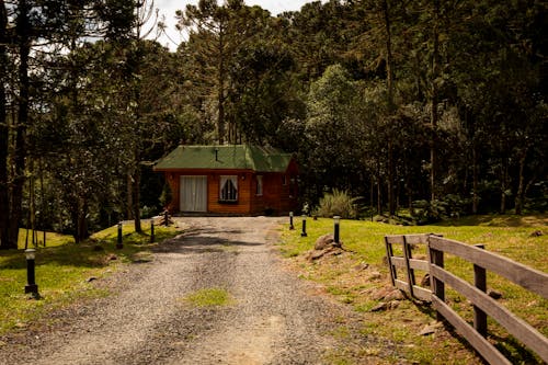 Wooden Cottage and a Dirt Road 