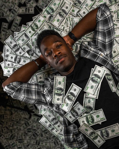 Man Lying Down with Money