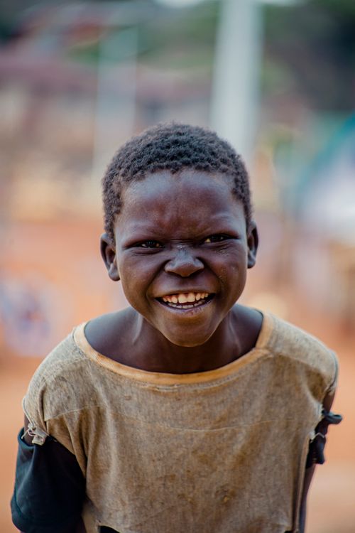 Free Capturing a joyful moment of a boy smiling brightly in an outdoor setting. Stock Photo