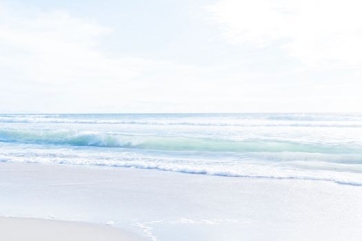 Gentle waves on a serene beach in Los Angeles under bright daylight.