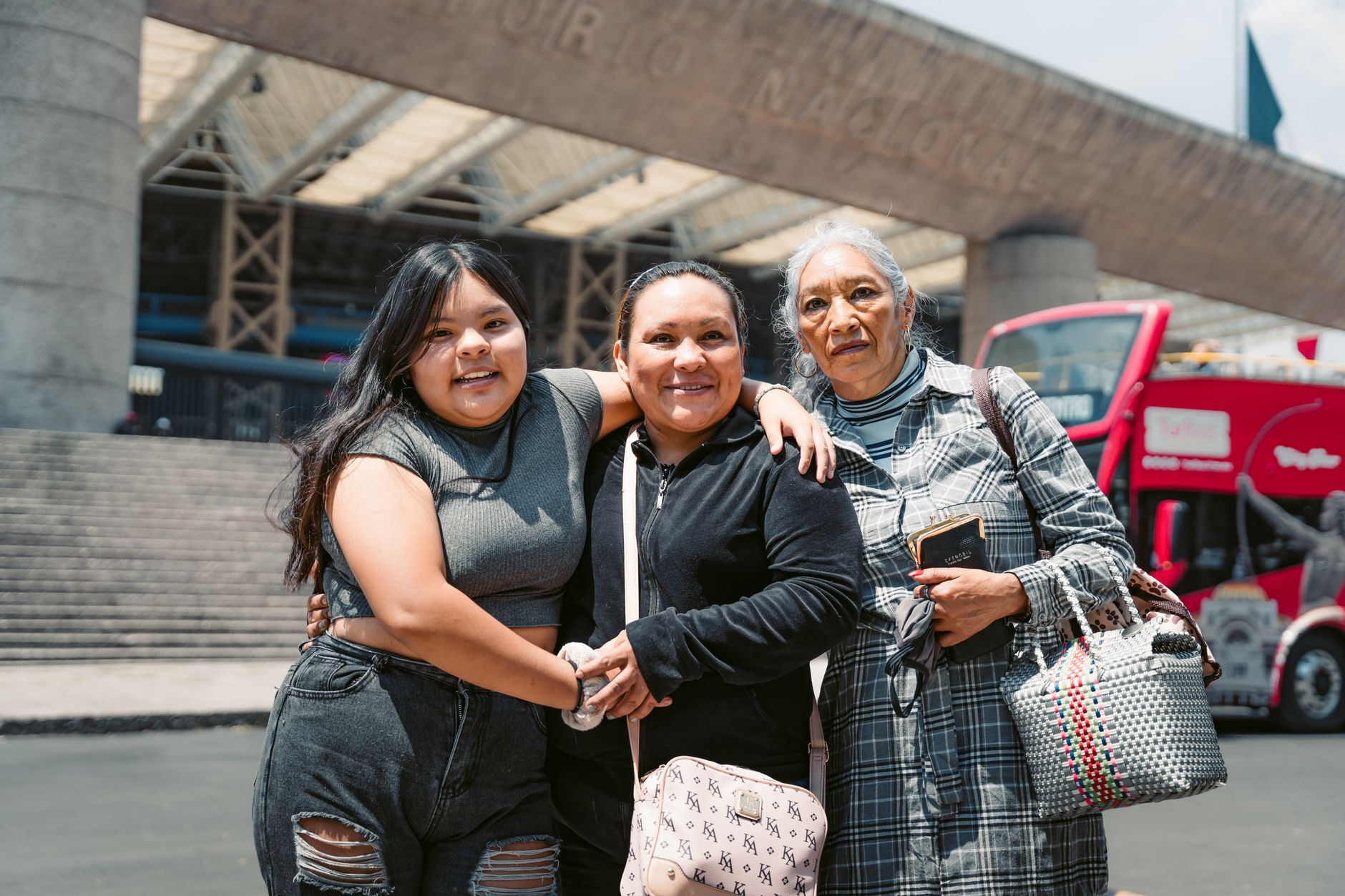 A joyful moment captured with three women at the National Museum in Mexico City, highlighting culture and connection.