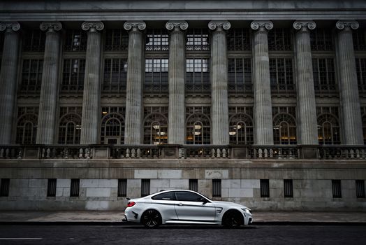 Car in front of Neoclassical Building