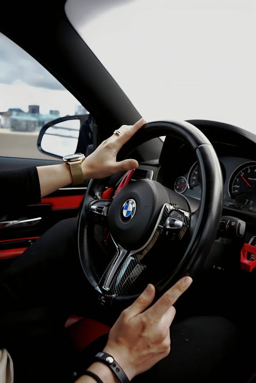 Man Driving a Modern BMW Car 