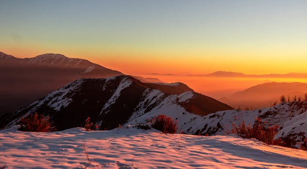 Stunning sunrise over the snow-covered Andes Mountains in the Santiago Metropolitan Region, Chile.