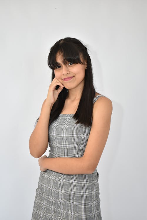 Smiling Woman in Gray Dress