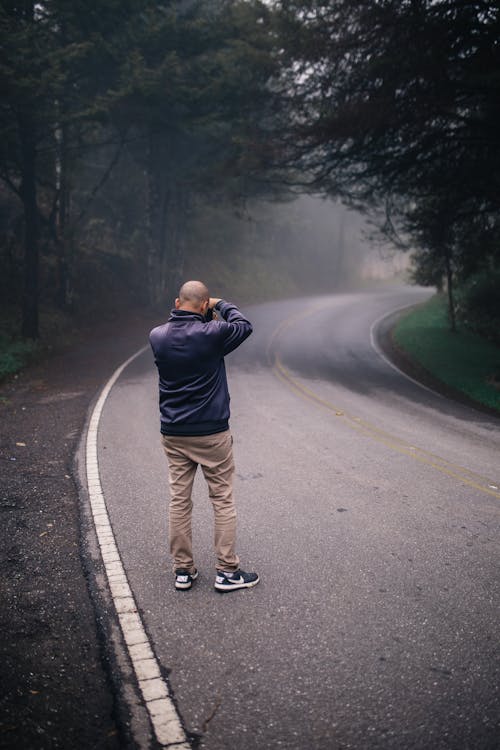 Man Standing On Road