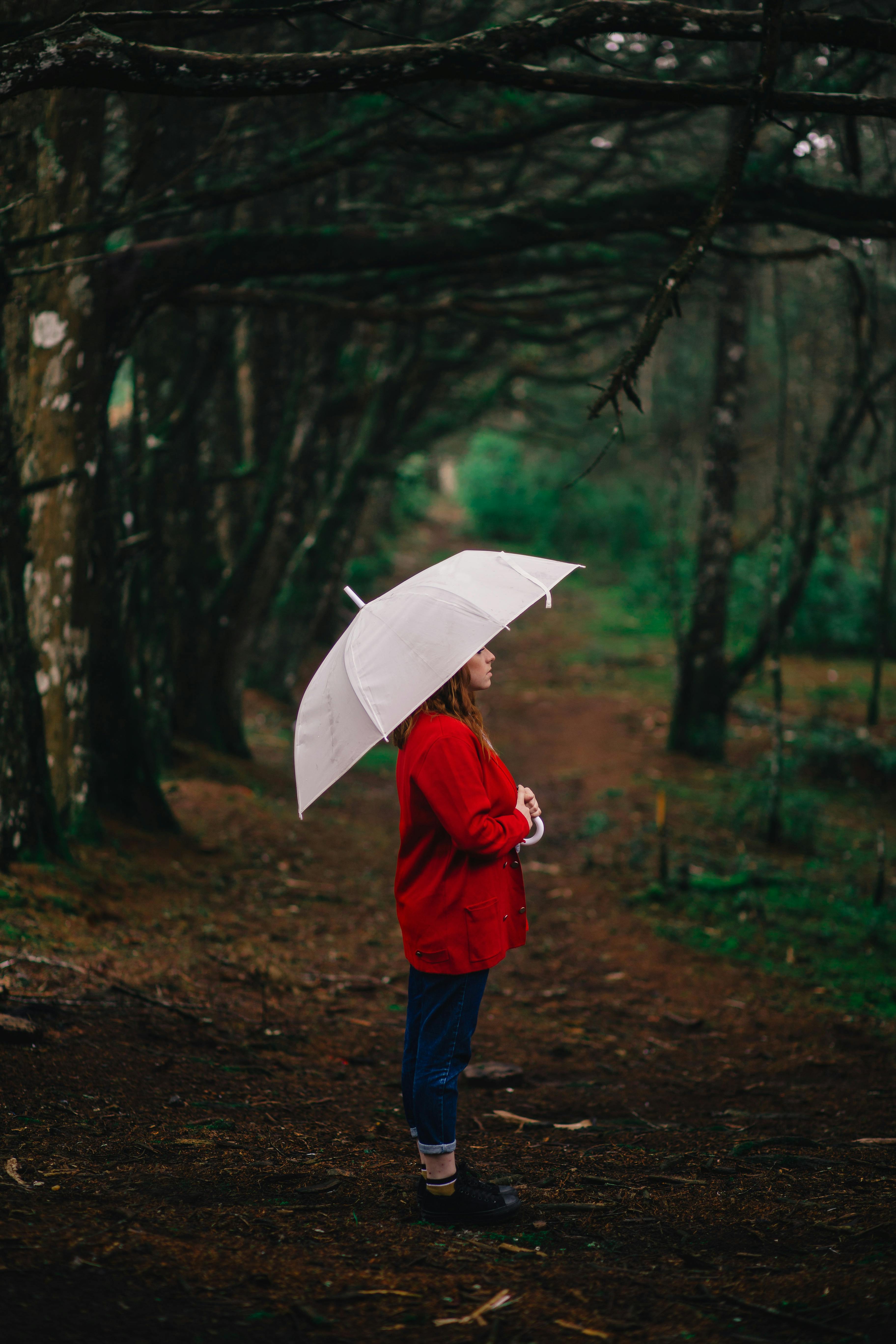 woman standing beside trees