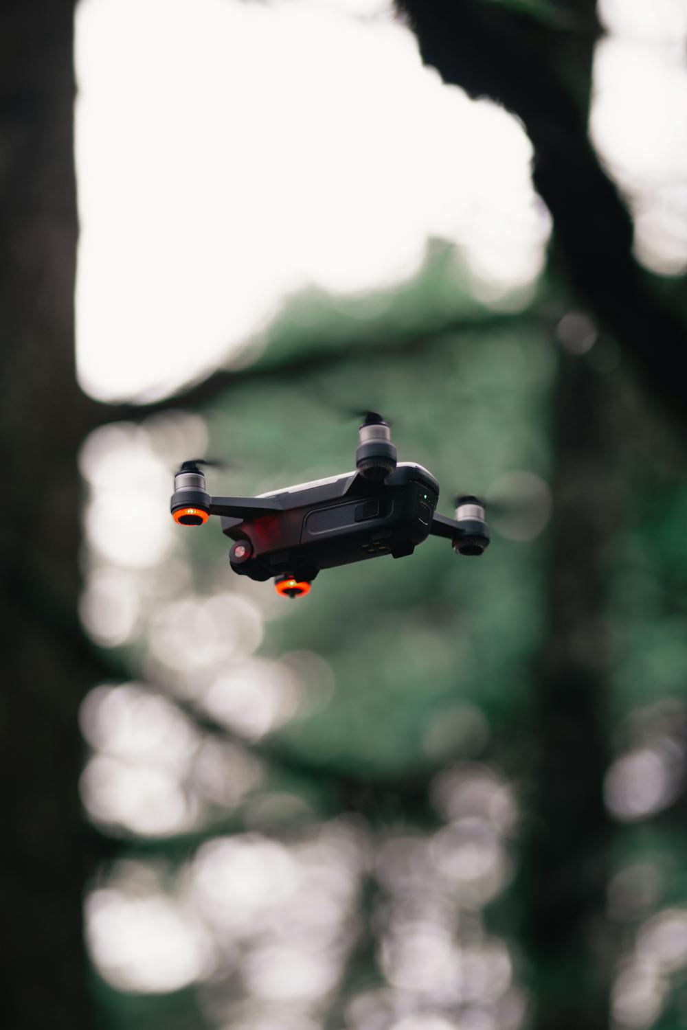 Black Quadcopter Drone Hovering Midair · Free Stock Photo