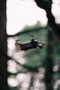 Black Quadcopter Drone Hovering Mid-air