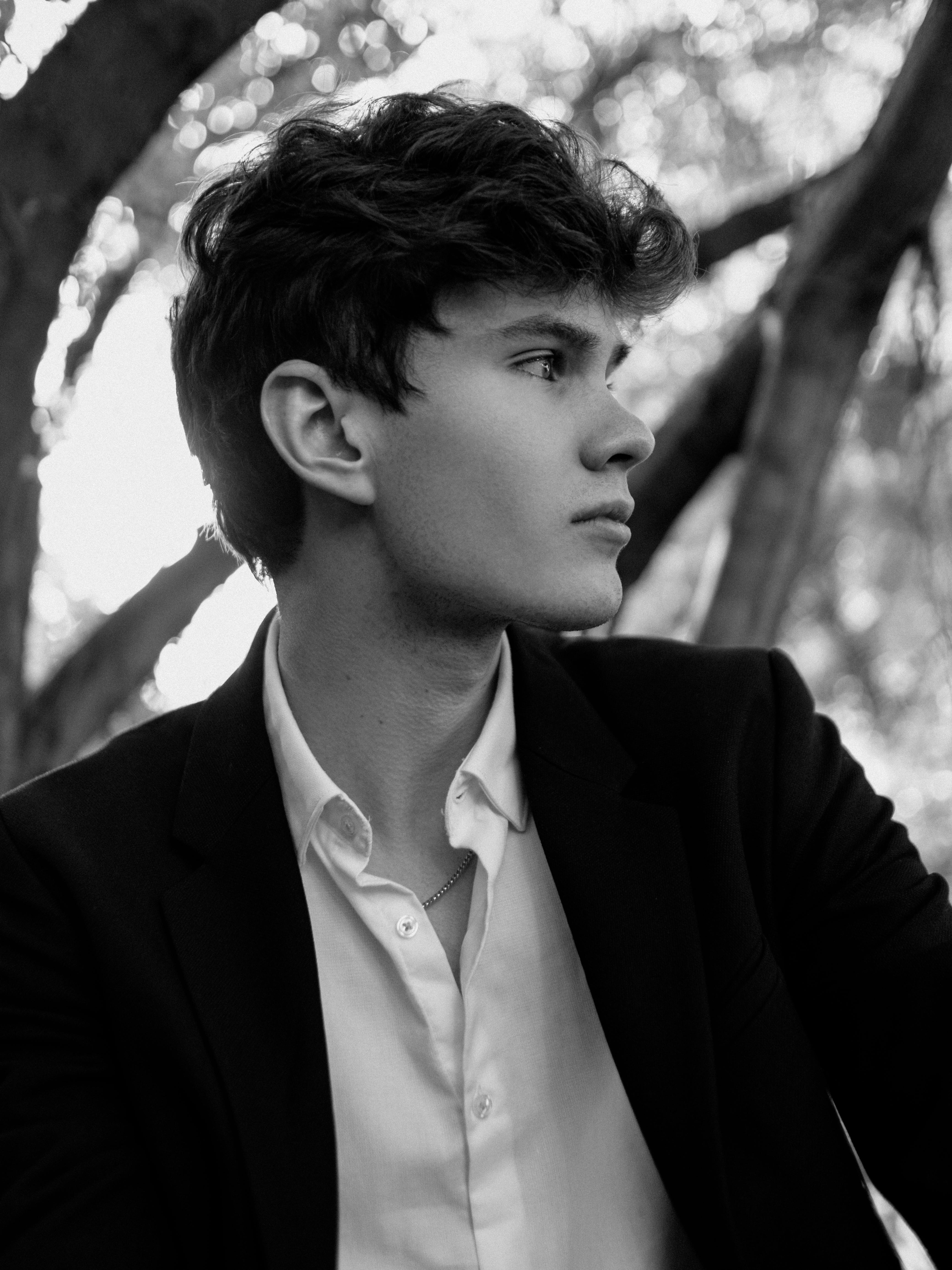 young man in suit black and white