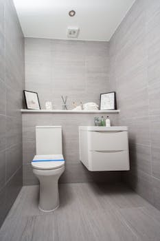 Discover modern elegance in this minimalist bathroom with sleek fixtures and contemporary decor.
