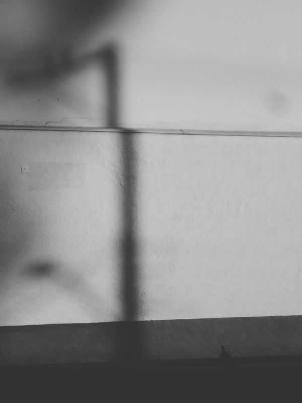 Monochrome shadow abstraction — photo by Raphael Brasileiro on Pexels