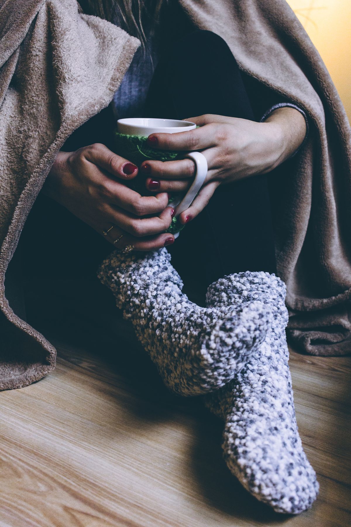 Person relaxing with a warm drink