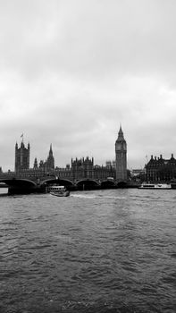 Dramatic monochrome view of Big Ben and Westminster Bridge over the River Thames in London.
